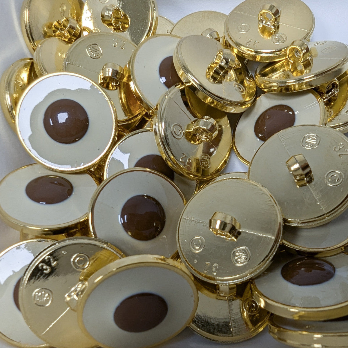 Gold plastic buttons, 2cm, with hand-painted cream and brown two-tone design.