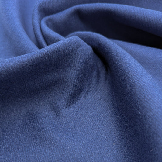 Dark blue deadstock wool-rabbit doubleface fabric, softly draped, showing its texture.