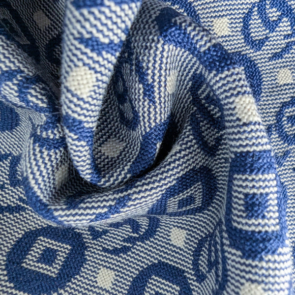 Deadstock G*cci denim fabric, 23x19 cm, with a blue and white logo pattern and textured weave.