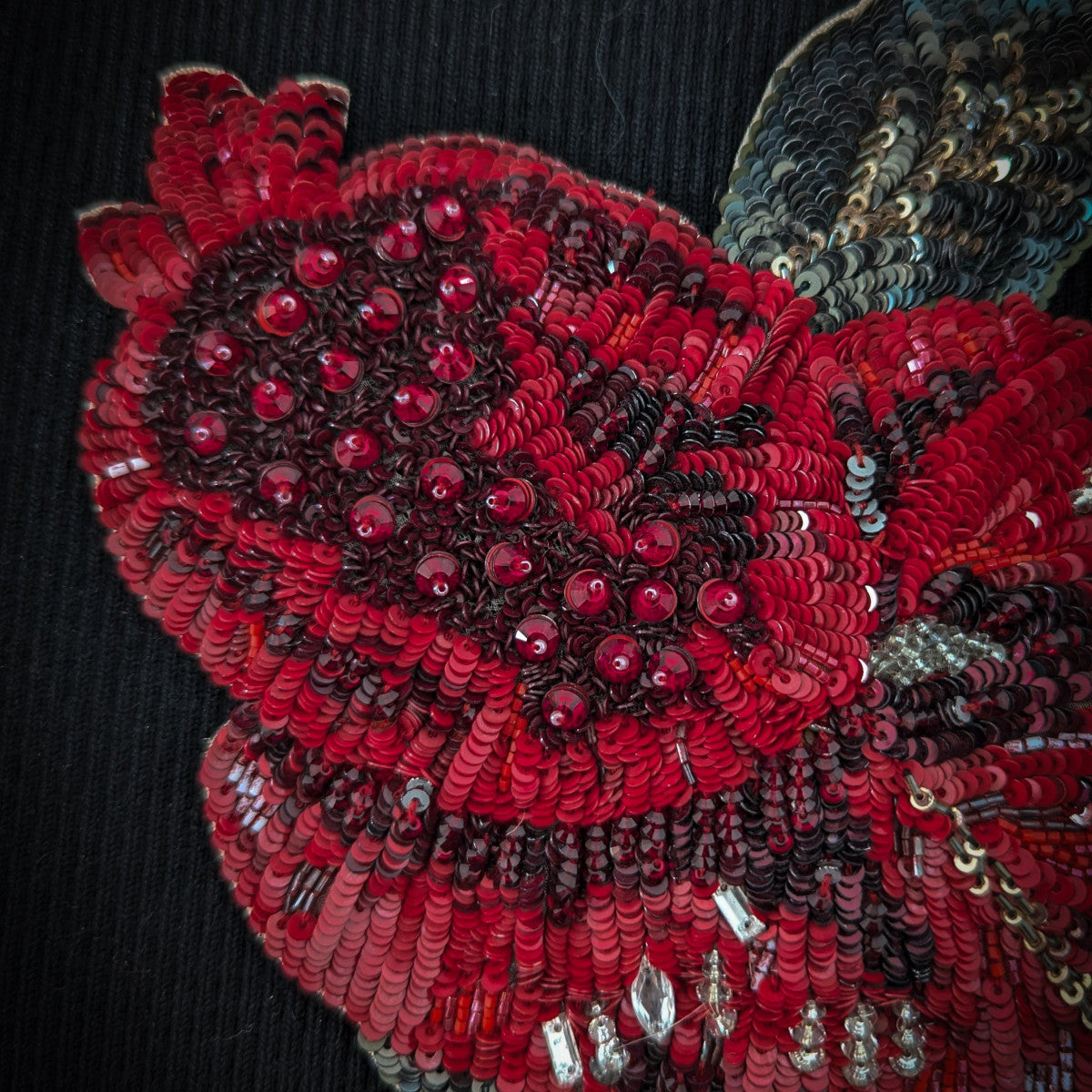 D&G red rose patch with sequins and pearls, 25cm, on a black fabric background.