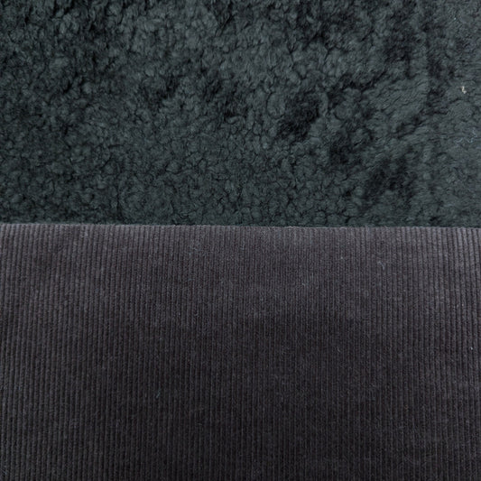 Dark gray doubleface corduroy fabric with a soft teddy fleece backing.