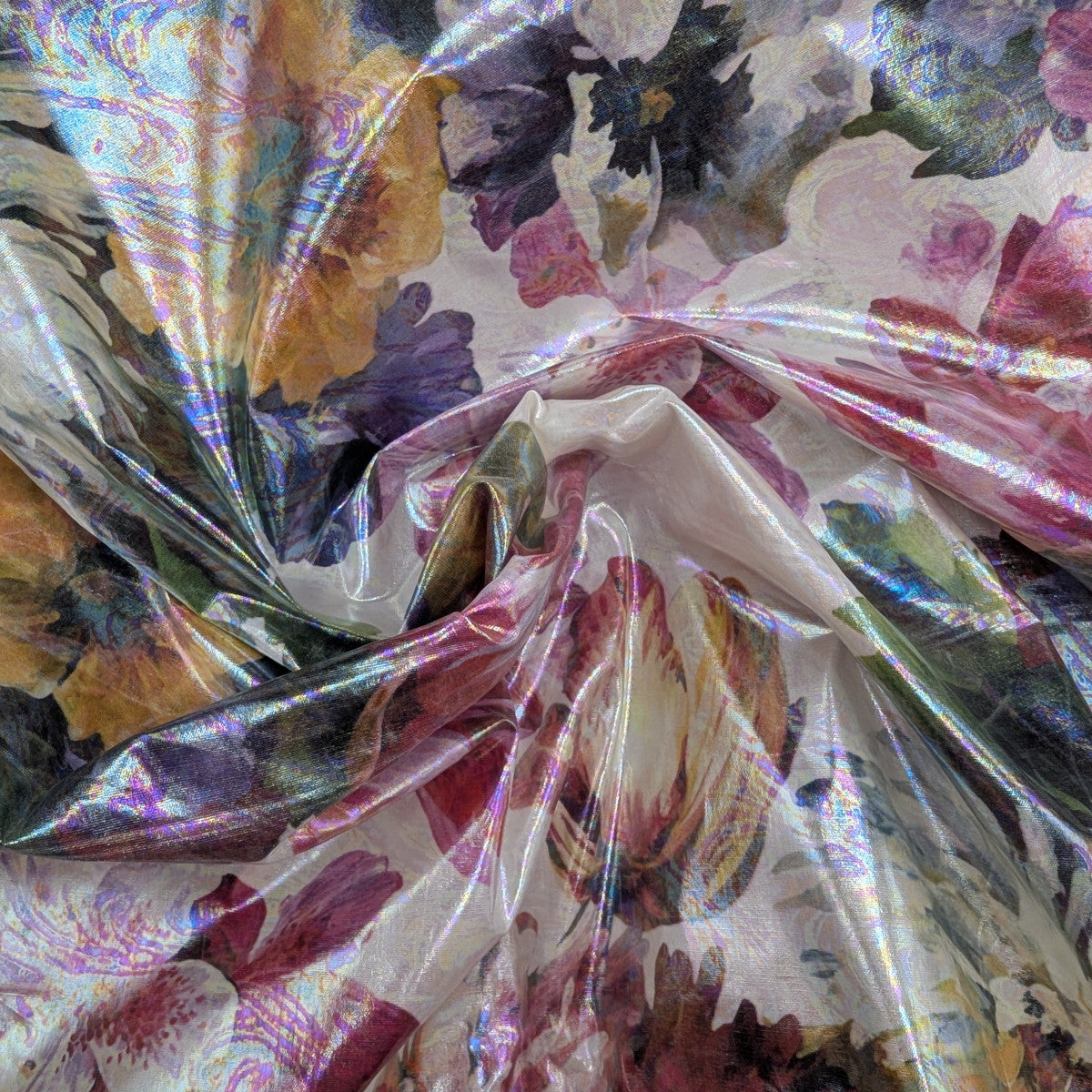 Shimmering D&G deadstock cotton fabric, water-repellent coated, with a vibrant floral print in purple, pink, and gold.
