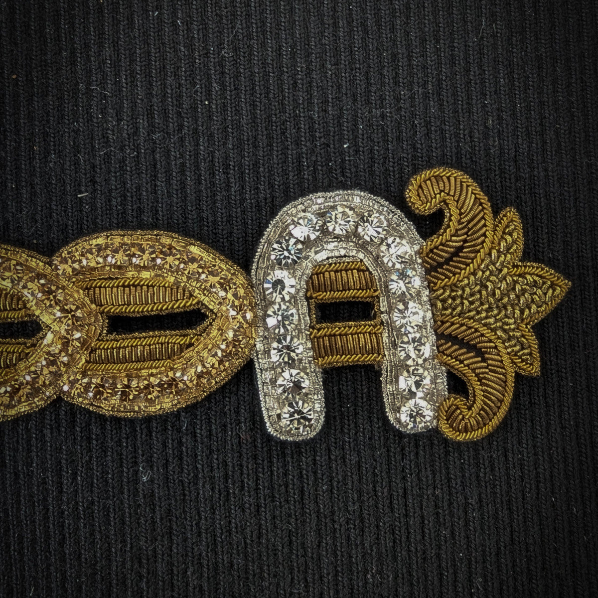 D&G patch with gold embroidery, clear stones, and metallic stitching on a black background, 18 cm.