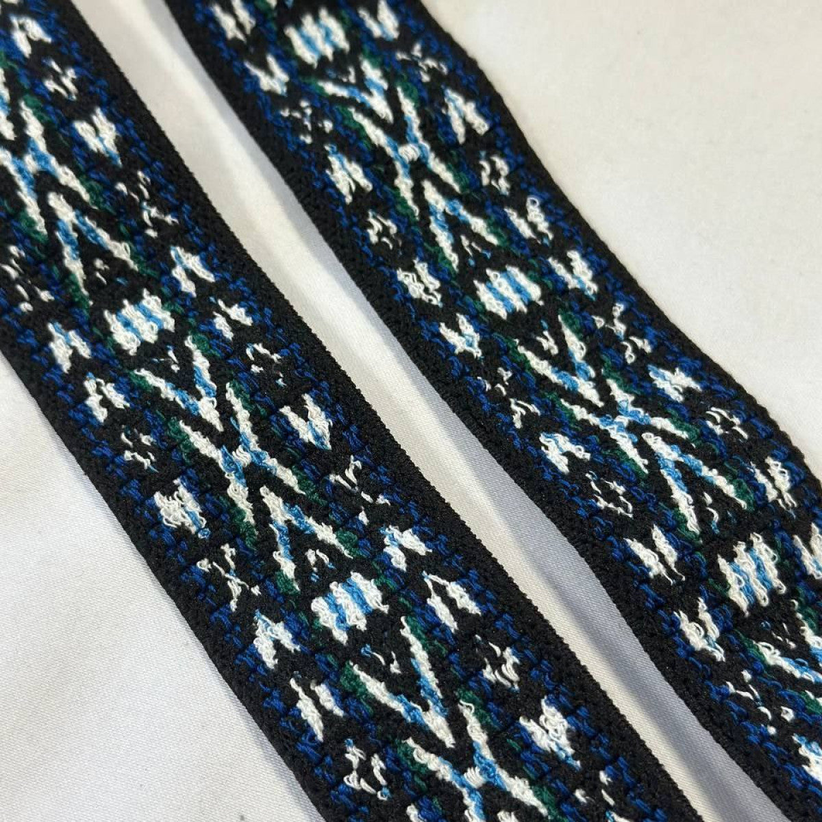 Black designer fabric band with blue, green, and white geometric pattern, 50 cm.