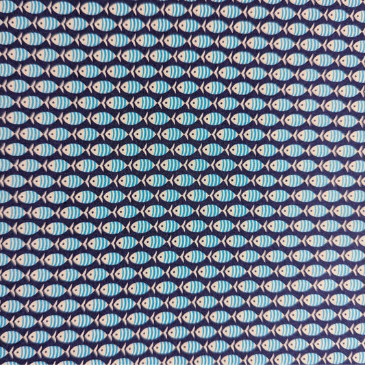 Dark blue cotton poplin fabric with a repeating pattern of light blue striped fish.
