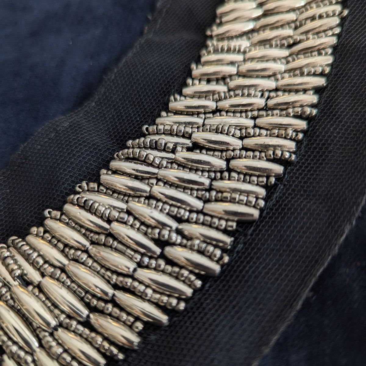 D&G black fabric patch with rows of silver metallic beads and small pearls.