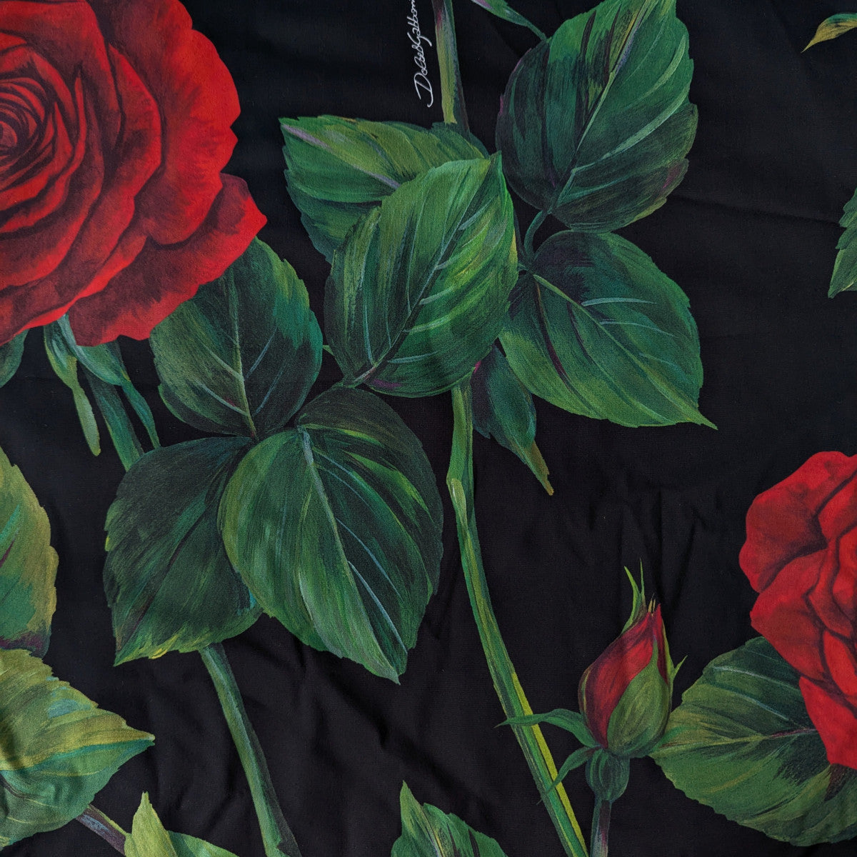 Black Lycra deadstock D&G fabric, 45x45cm, with vibrant red roses and green leaves.