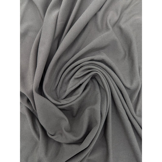 Elegant mud grey Mich*l K*rs deadstock viscose jersey crepe fabric with flowing drape and fine texture.