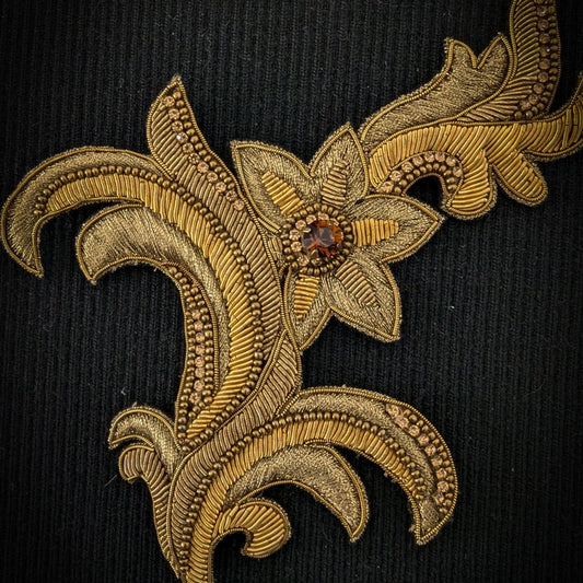 D&G 14cm gold metal embroidery ornament patch with a central jewel and intricate floral design.