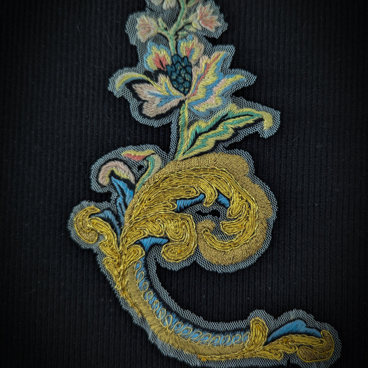 D&G 18cm ornate gold and blue metallic embroidery patch with floral design on black fabric.