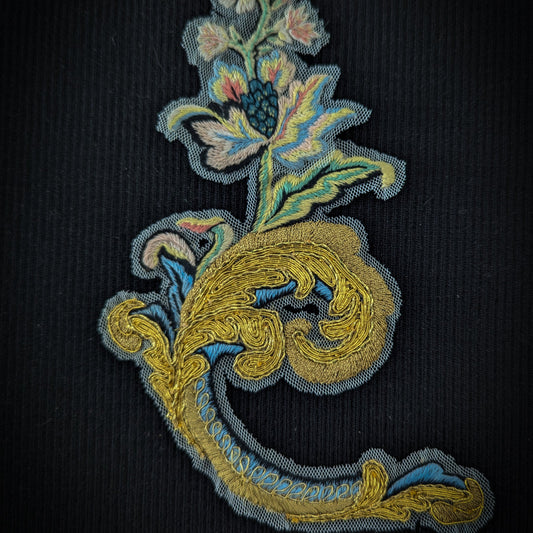 D&G 18cm ornate gold and blue metallic embroidery patch with floral design on black fabric.