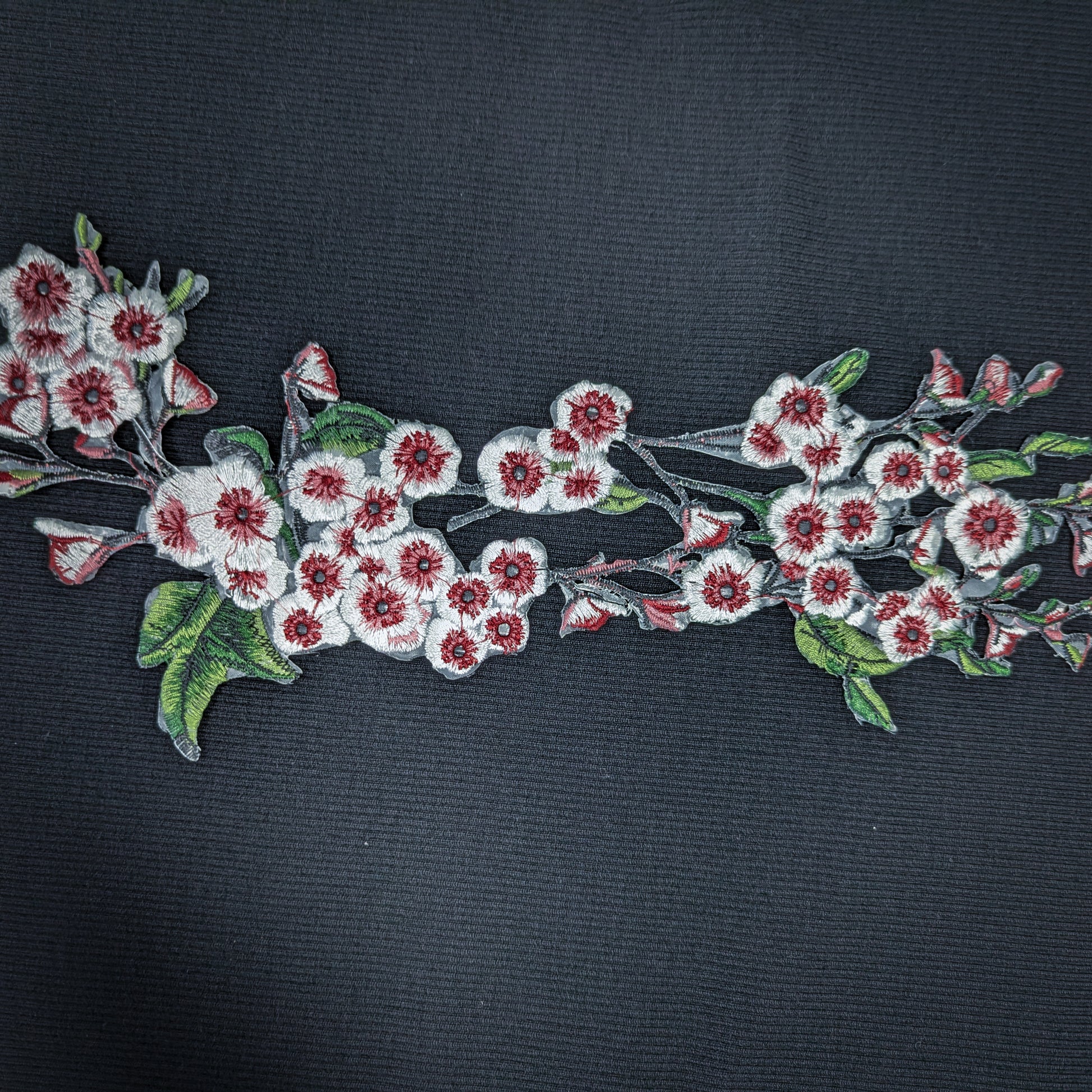 XXL G*cci knitted cherry blossom patch, 40cm, with white and red embroidered flowers and green leaves.