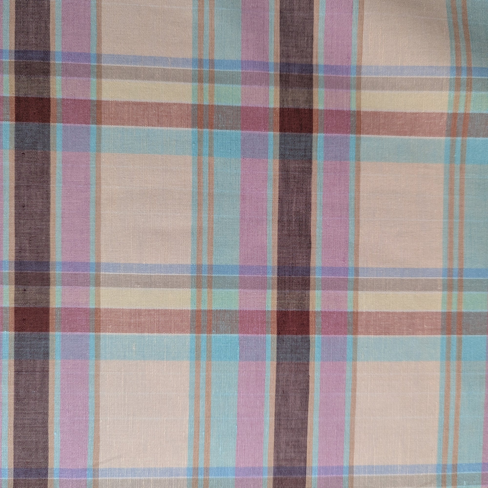 G*cci deadstock cotton-linen tartan fabric with beige, pink, blue, and brown plaid pattern.