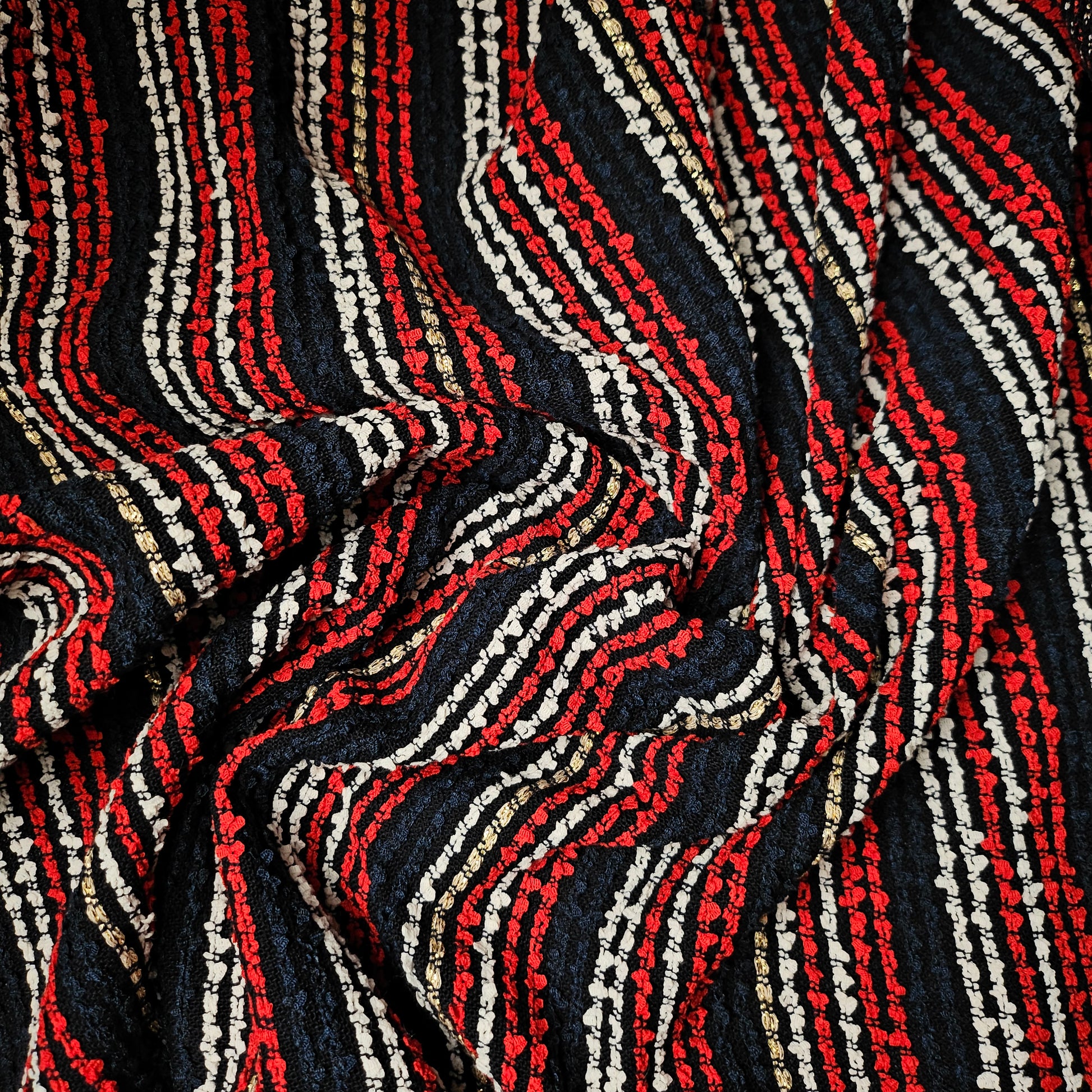 Deadstock G*cci tweed fabric, dark blue with red, white, and gold striped lurex shimmer.