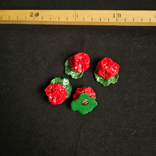Four D&G deadstock plastic buttons, 4x4cm, featuring glossy red flowers with green leaves on a black background.