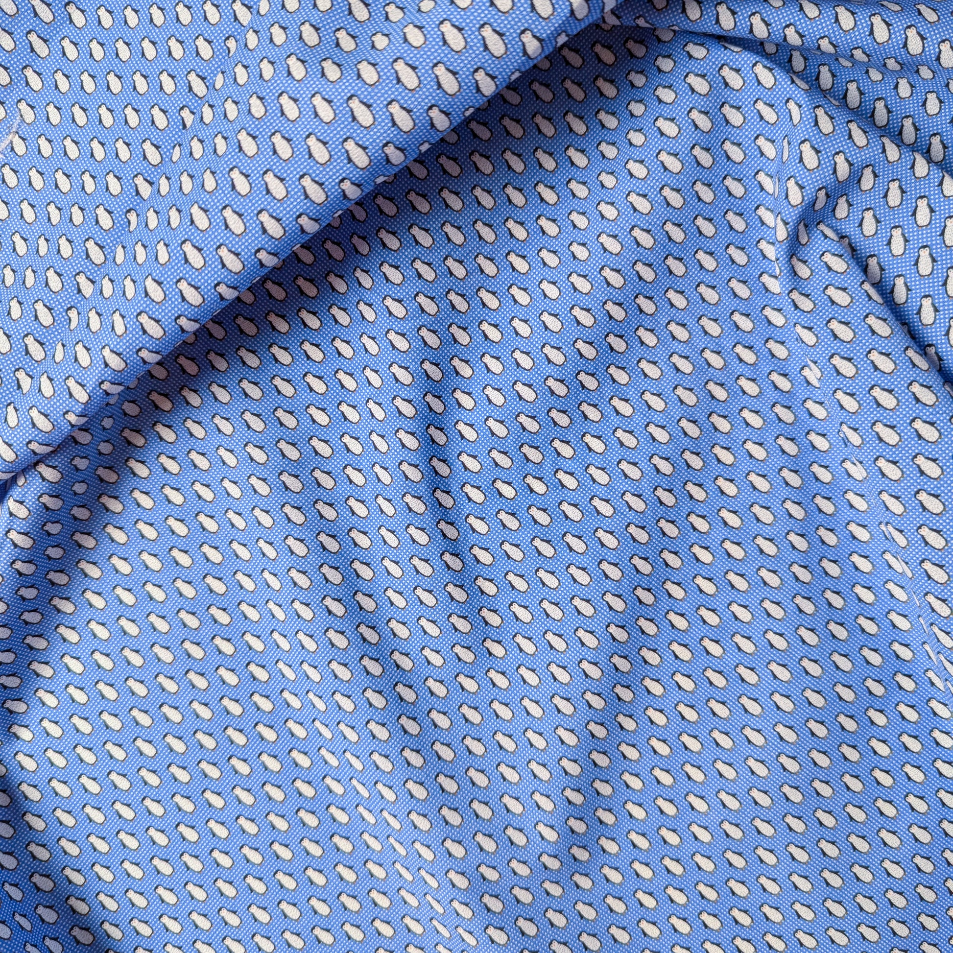 Blue deadstock cotton poplin fabric with a small white teardrop pattern.