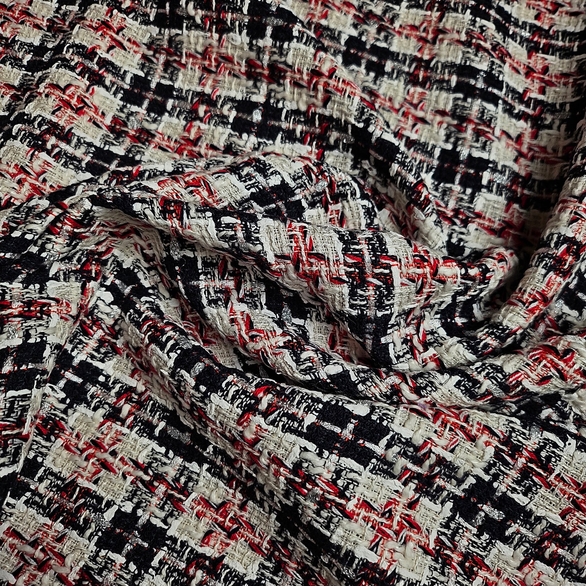 Deadstock G*cci tweed fabric, 145cm, with a textured black, white, and red woven pattern.
