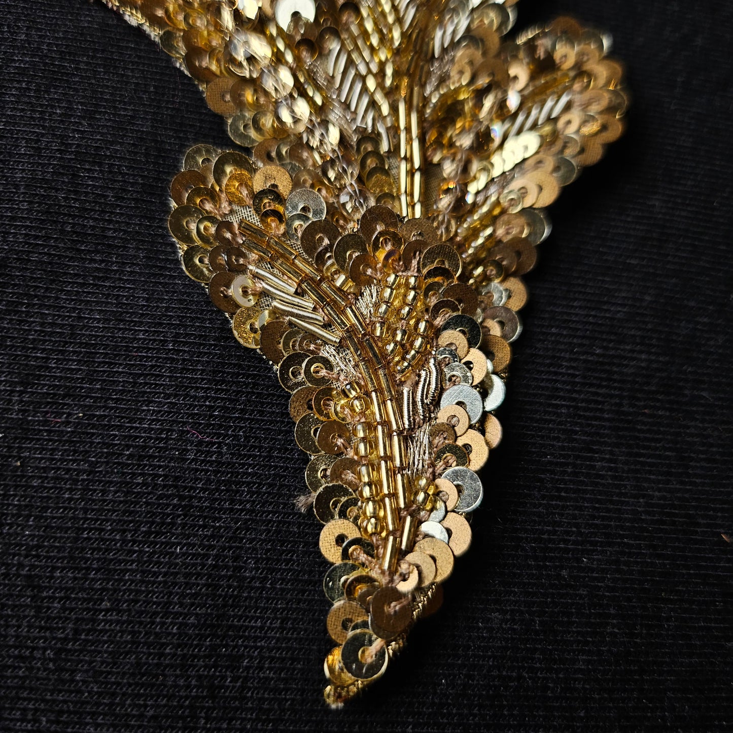 D&G gold sequin and bead embroidery patch, 7x9 cm, on a black background.
