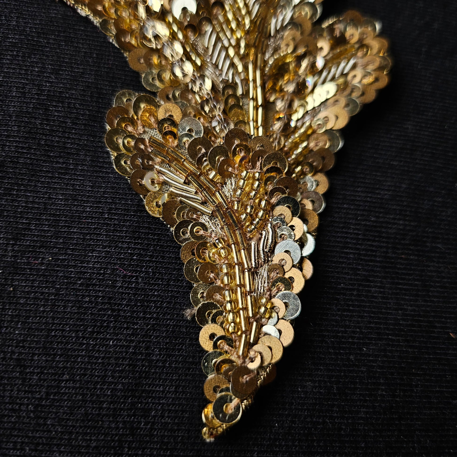 D&G gold sequin and bead embroidery patch, 7x9 cm, on a black background.
