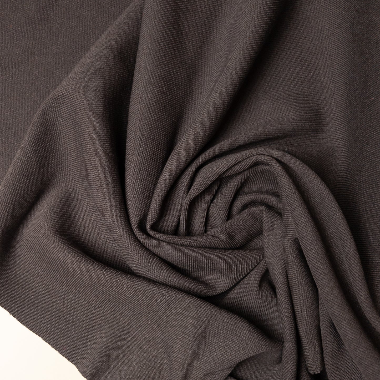 Taubengrau ribbed knit deadstock fabric, 100 cm wide, with a subtle diagonal texture.