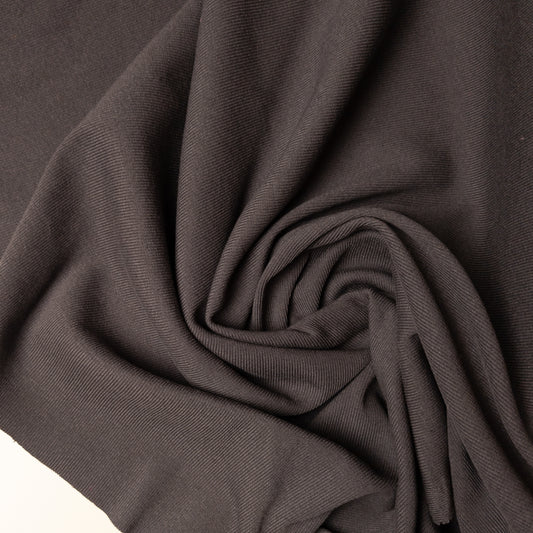 Taubengrau ribbed knit deadstock fabric, 100 cm wide, with a subtle diagonal texture.