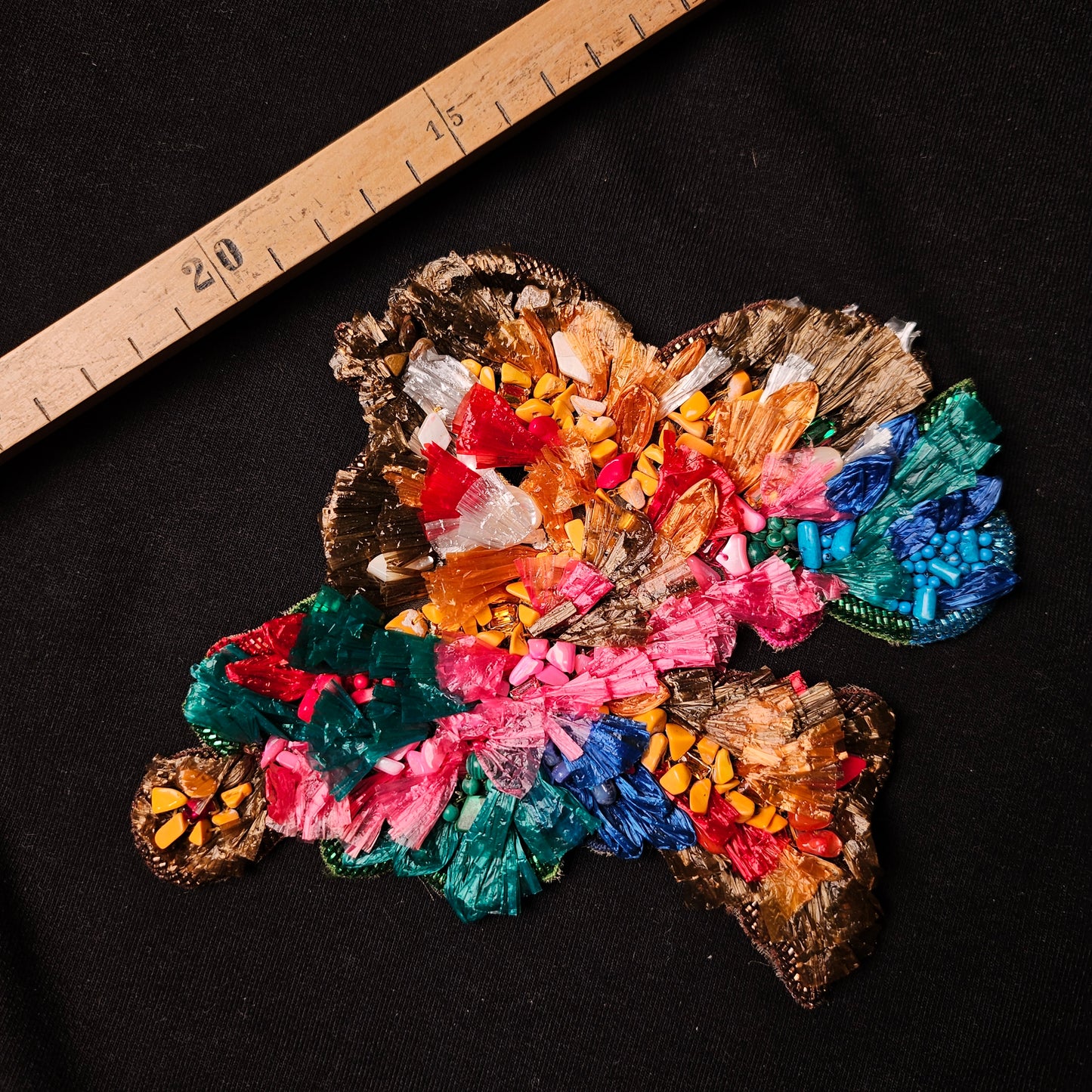 D&G floral patch, 13x14 cm, with colorful flower embroidery and beads on a dark background.