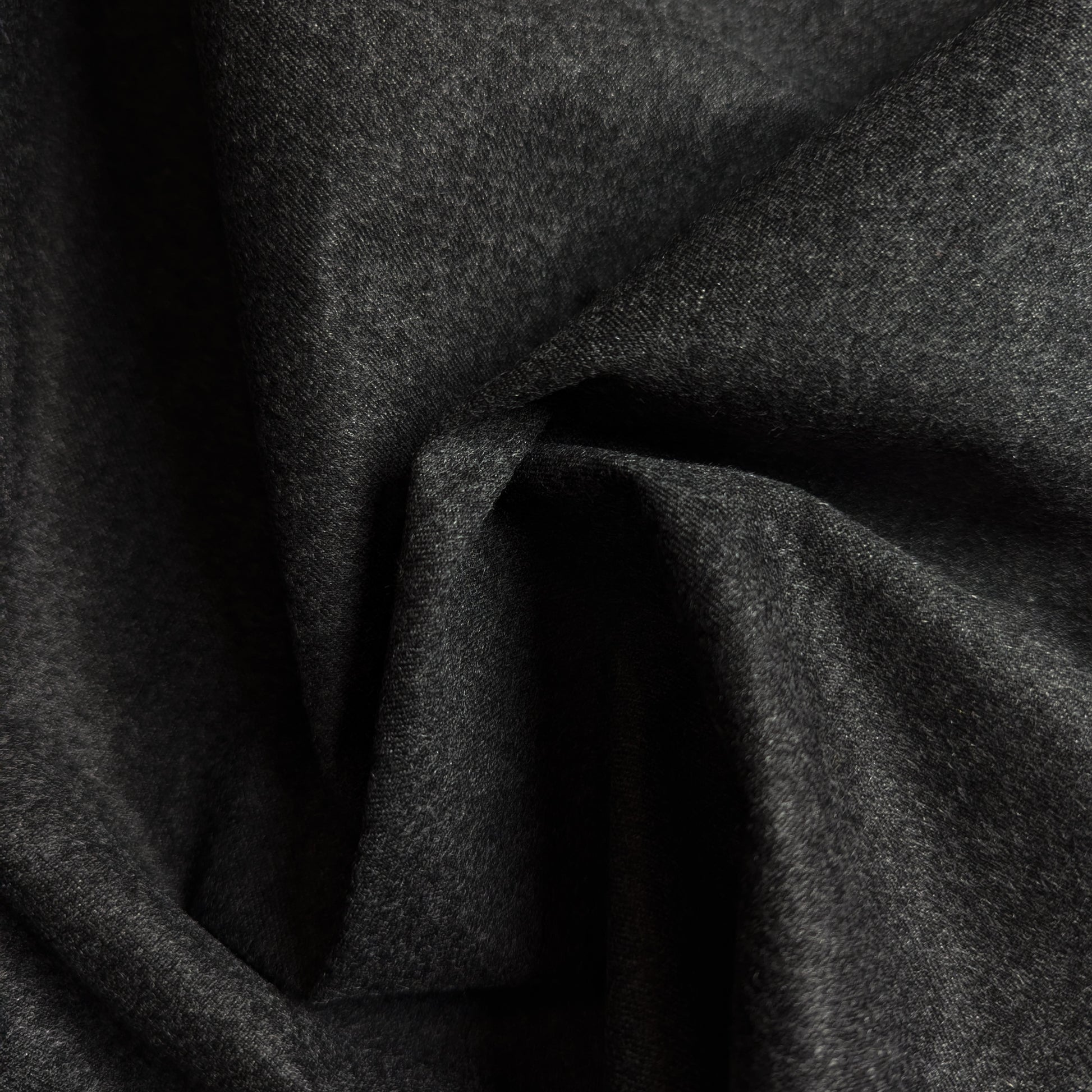 Anthracite Loro Piana deadstock cashmere Storm System fabric, draped with soft folds.