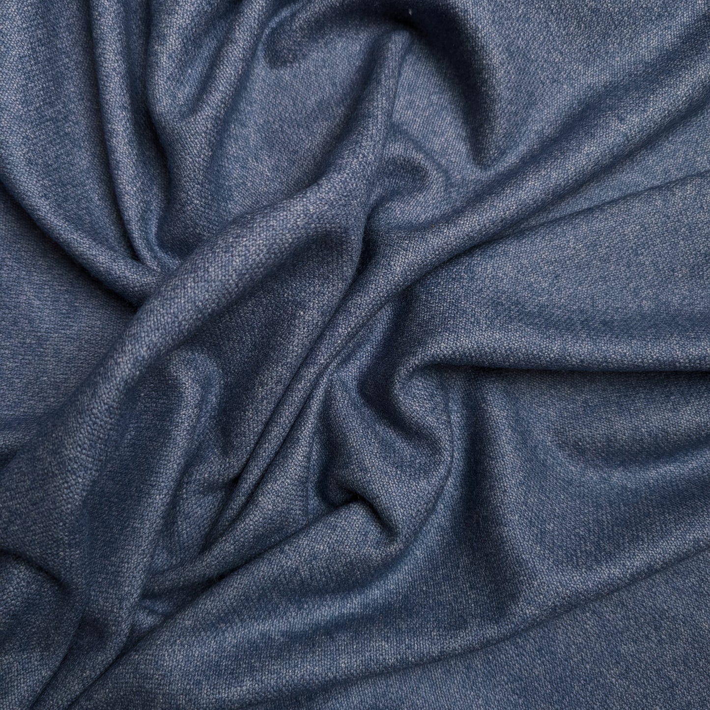 Stonewashed blue wool-cashmere blend deadstock fabric, 150cm wide, with soft drapes.