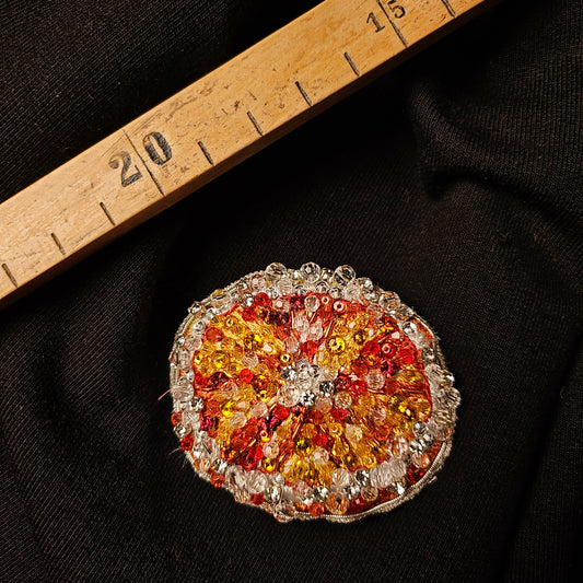 D&G 3D orange fruit patch, 5x6cm, with red, orange, and yellow beads on black fabric.
