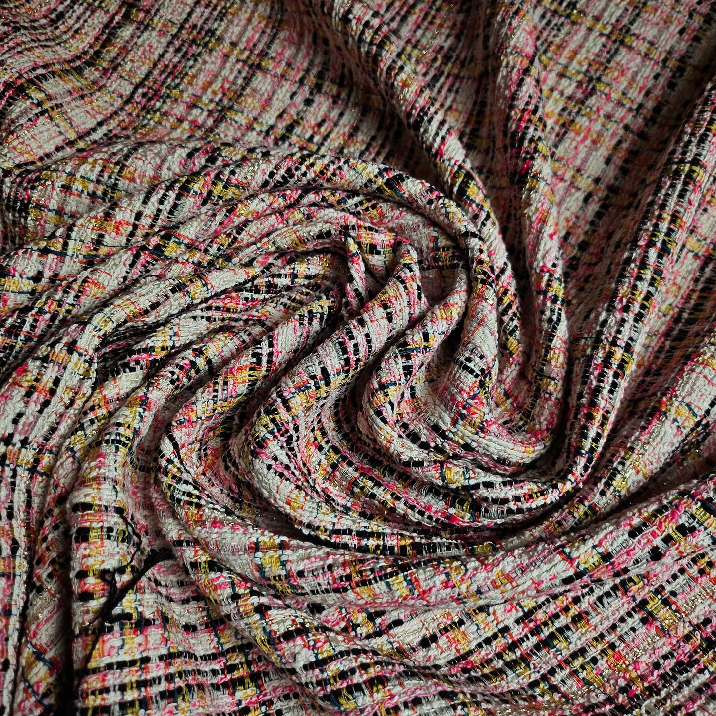 Deadstock tweed cotton blend fabric in Whisper White, pink, neon yellow, and black with Lurex.