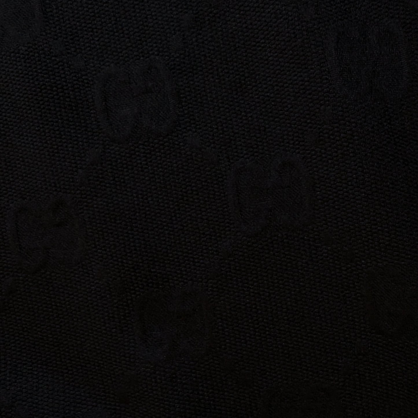 Black G*cci polyester jacquard fabric with subtle tone-on-tone logo and textured surface.
