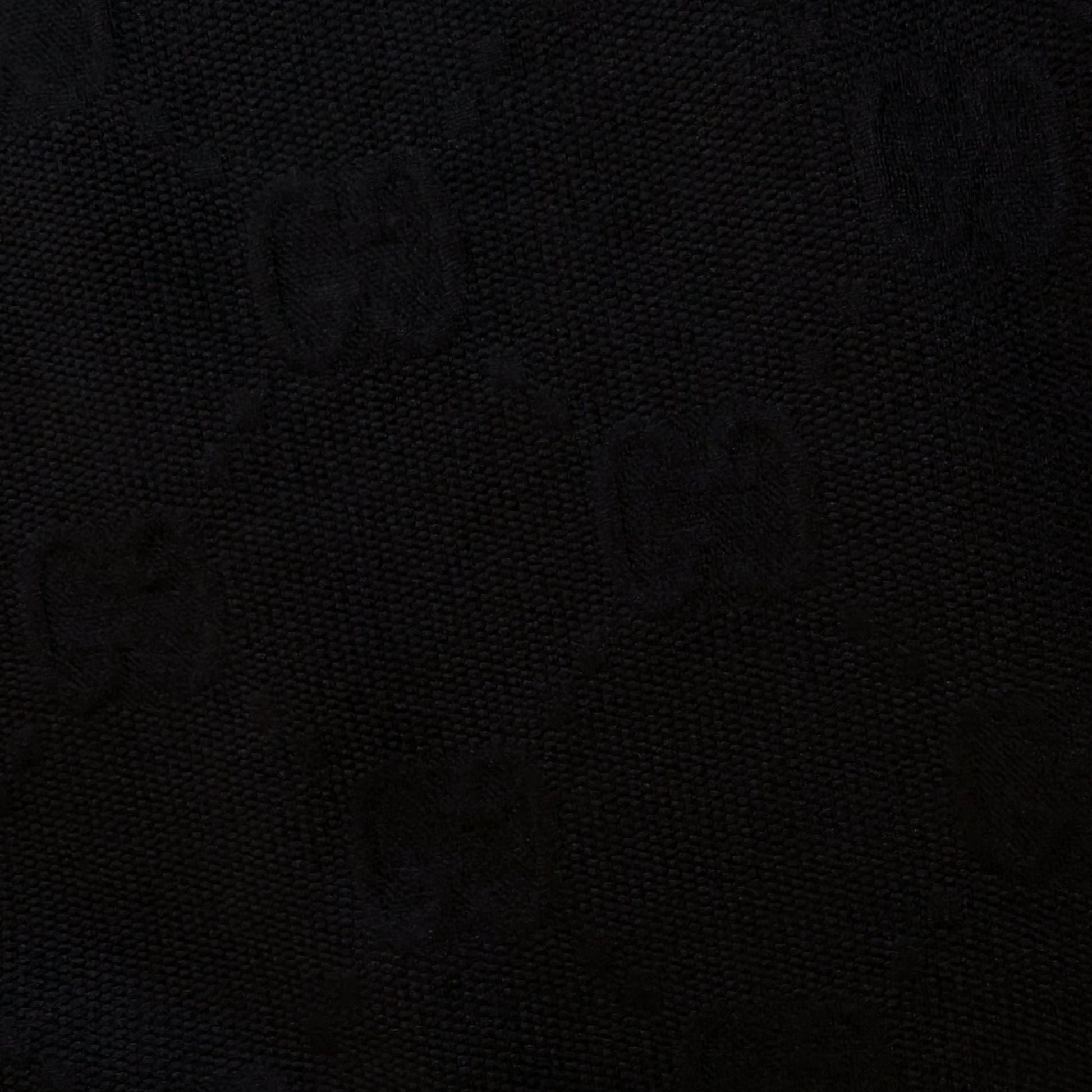 Black G*cci polyester jacquard fabric with subtle tone-on-tone logo and textured surface.
