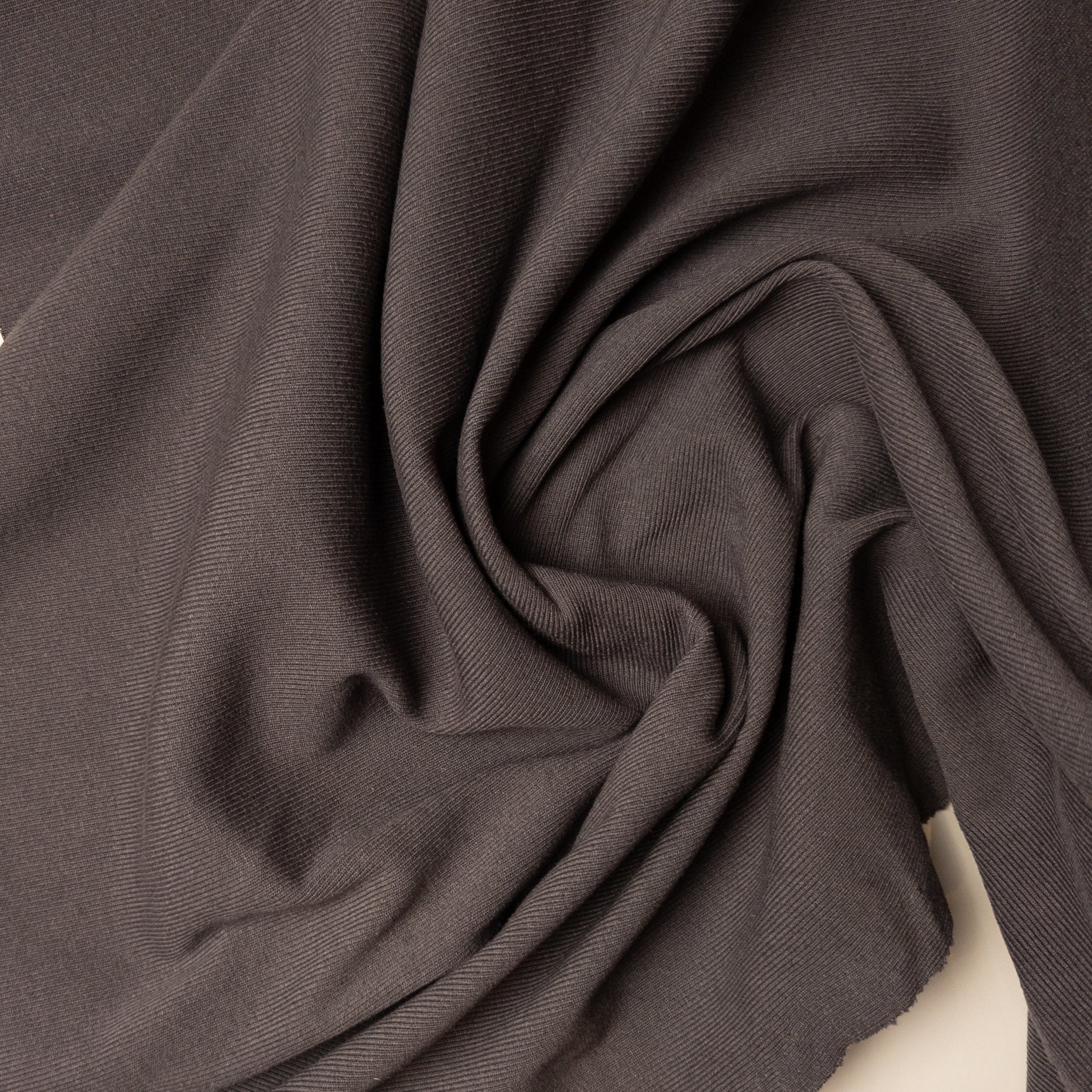 Taubengrau Ribstrick deadstock designer fabric, 100 cm wide, with a subtle ribbed texture and soft folds.