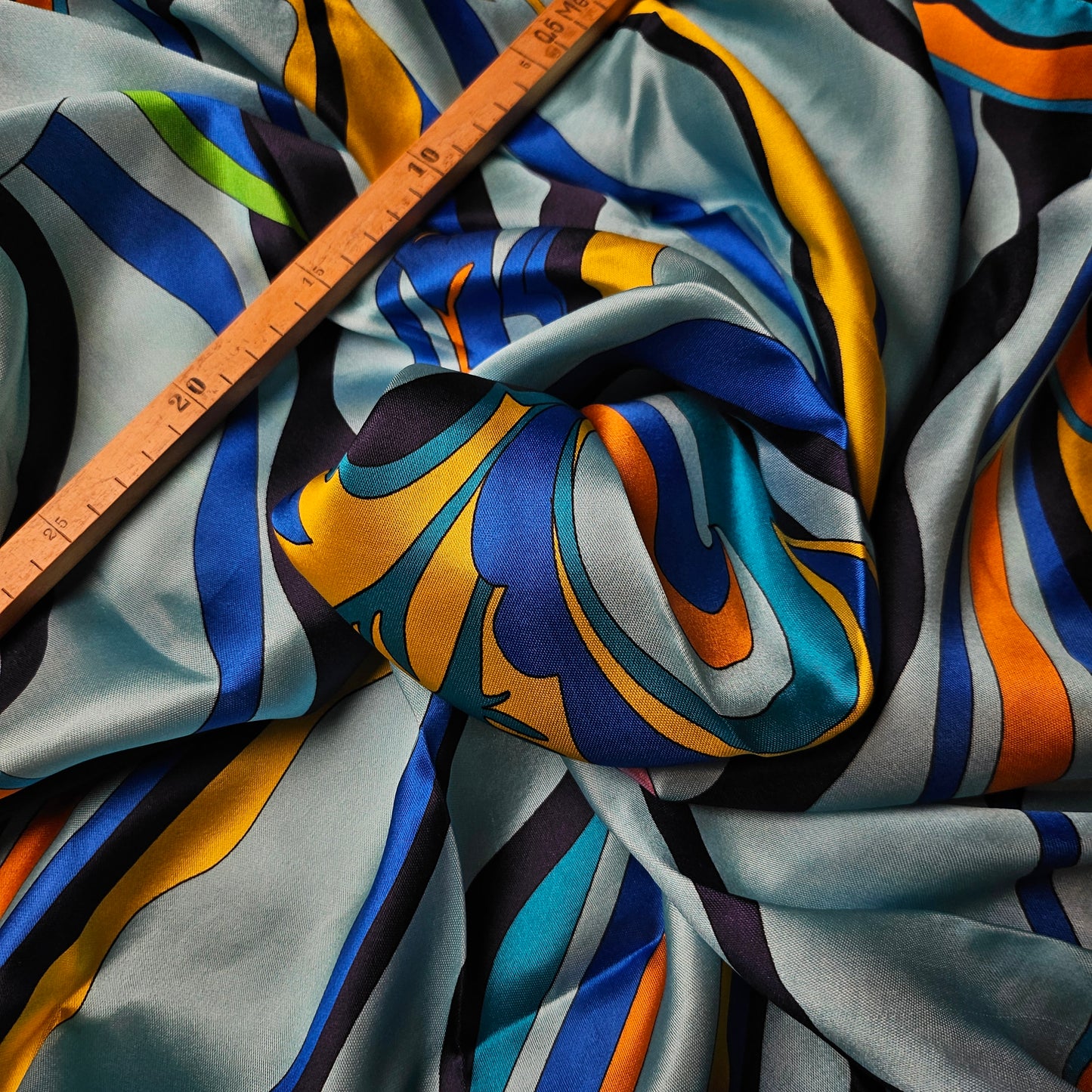 Multicolor P*cci deadstock twill silk scarf, 90x90 cm, with vibrant abstract waves and a ruler.