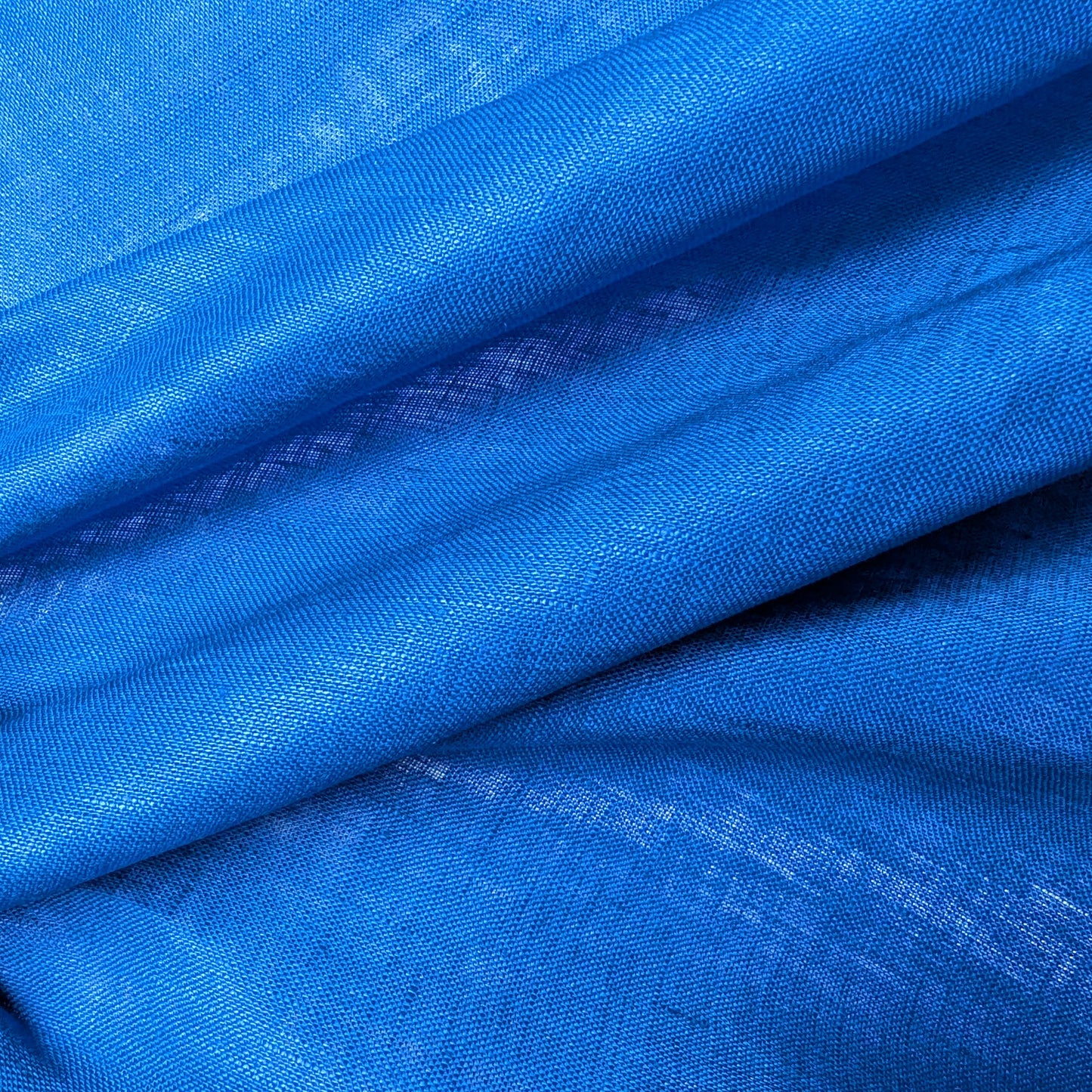 Deadstock chinose blue linen fabric, 135 cm wide, with a subtle sheen and visible weave texture.