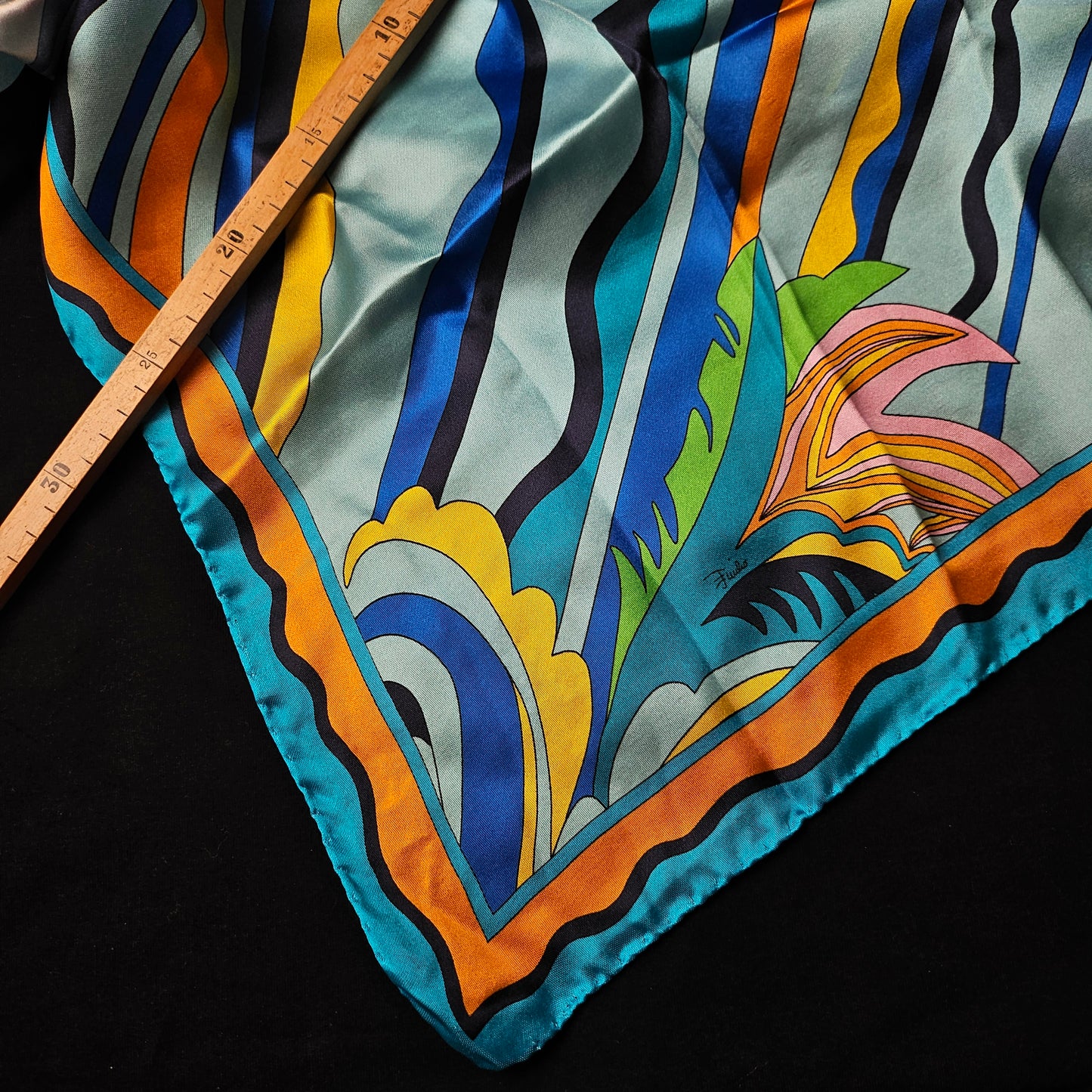 Multicolor P*cci deadstock twill silk scarf, 90x90 cm, with vibrant abstract patterns and a ruler.