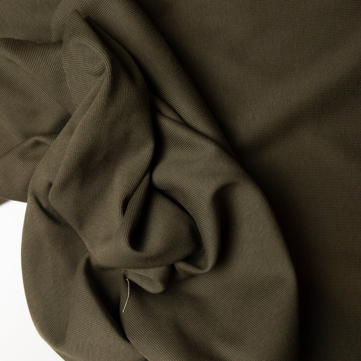 Dark olive green ribbed knit deadstock fabric, 100cm wide, with subtle melange texture.