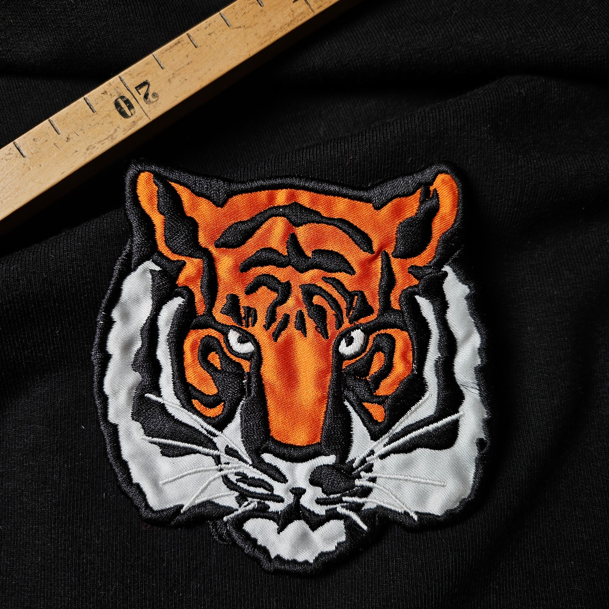 D&G deadstock textile patch, 10cm, featuring an orange, white, and black embroidered tiger head.