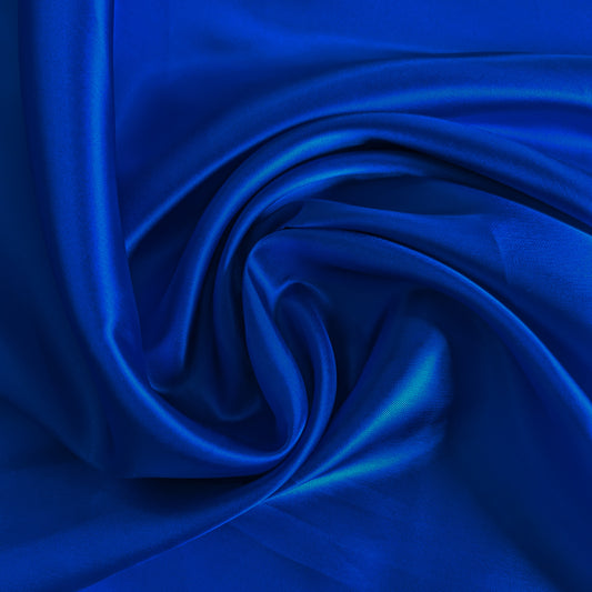 Rich blue Alexander McQueen deadstock viscose lining fabric, fine and glossy, with luxurious folds.