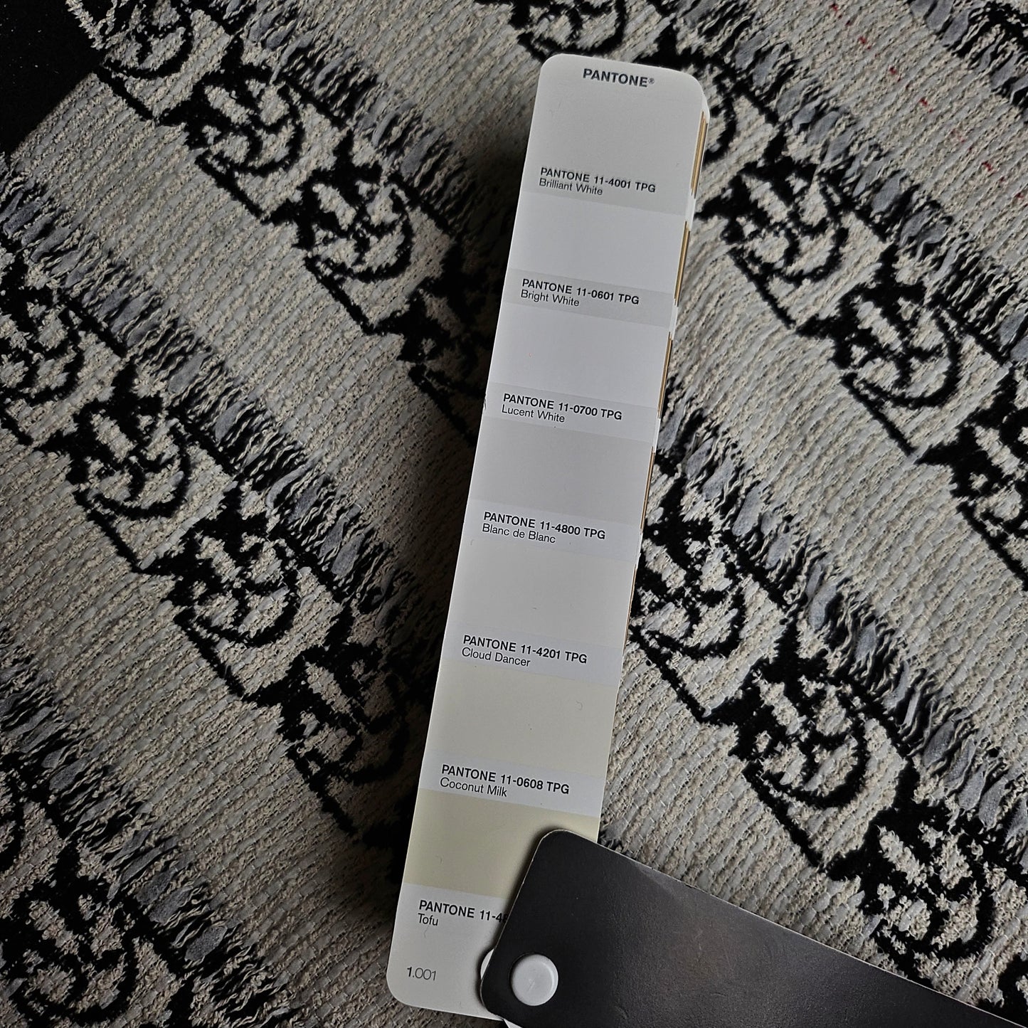 Pinko deadstock cotton tweed fabric, 150cm wide, with black Love Birds pattern and Pantone Coconut Milk swatch.