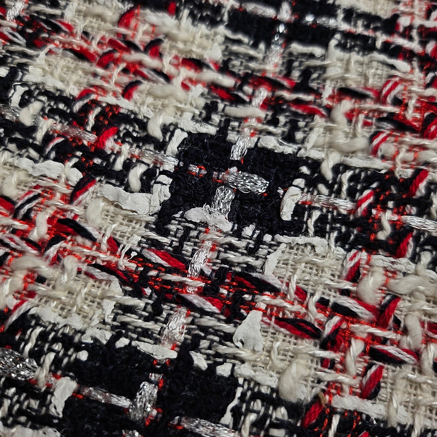Deadstock G*cci tweed fabric, 145cm wide, in star white, black, and red with metallic threads.