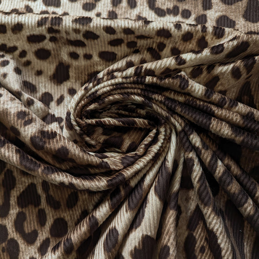 D&G deadstock corduroy fabric, 150cm wide, featuring a brown leopard print and subtle ribbing.