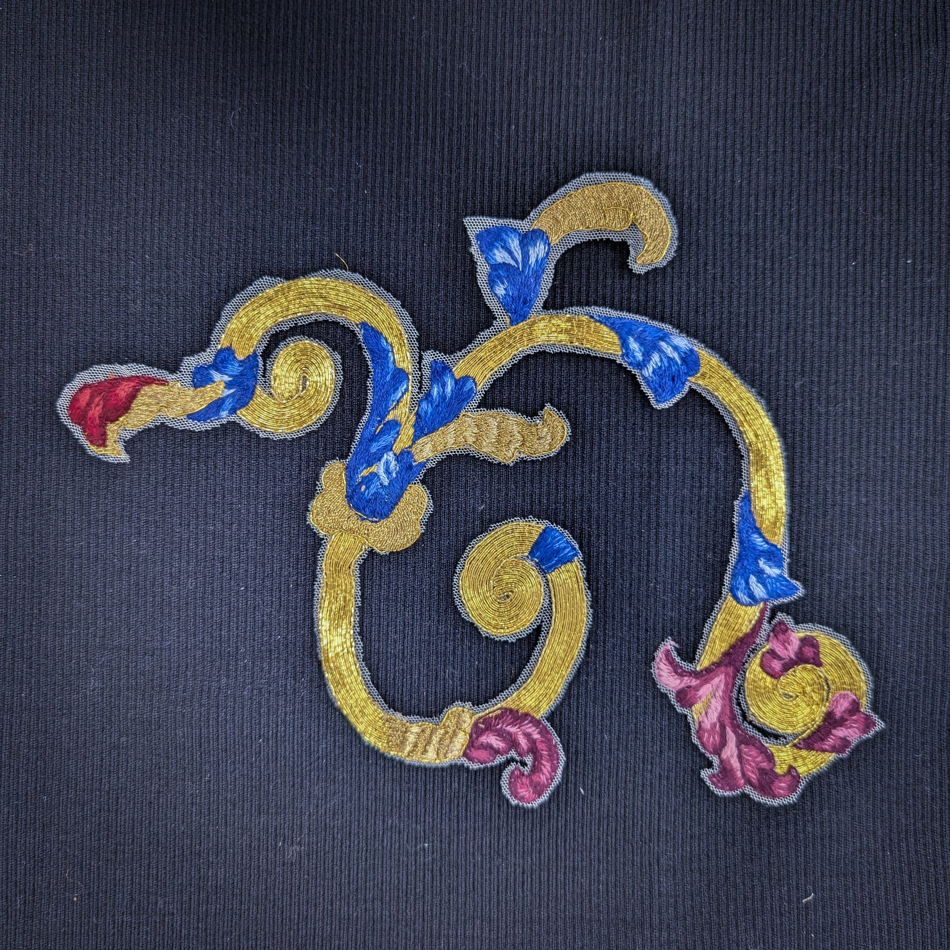 D&G gold embroidery patch with blue, red, and purple floral accents on fine tulle, 30x15 cm.