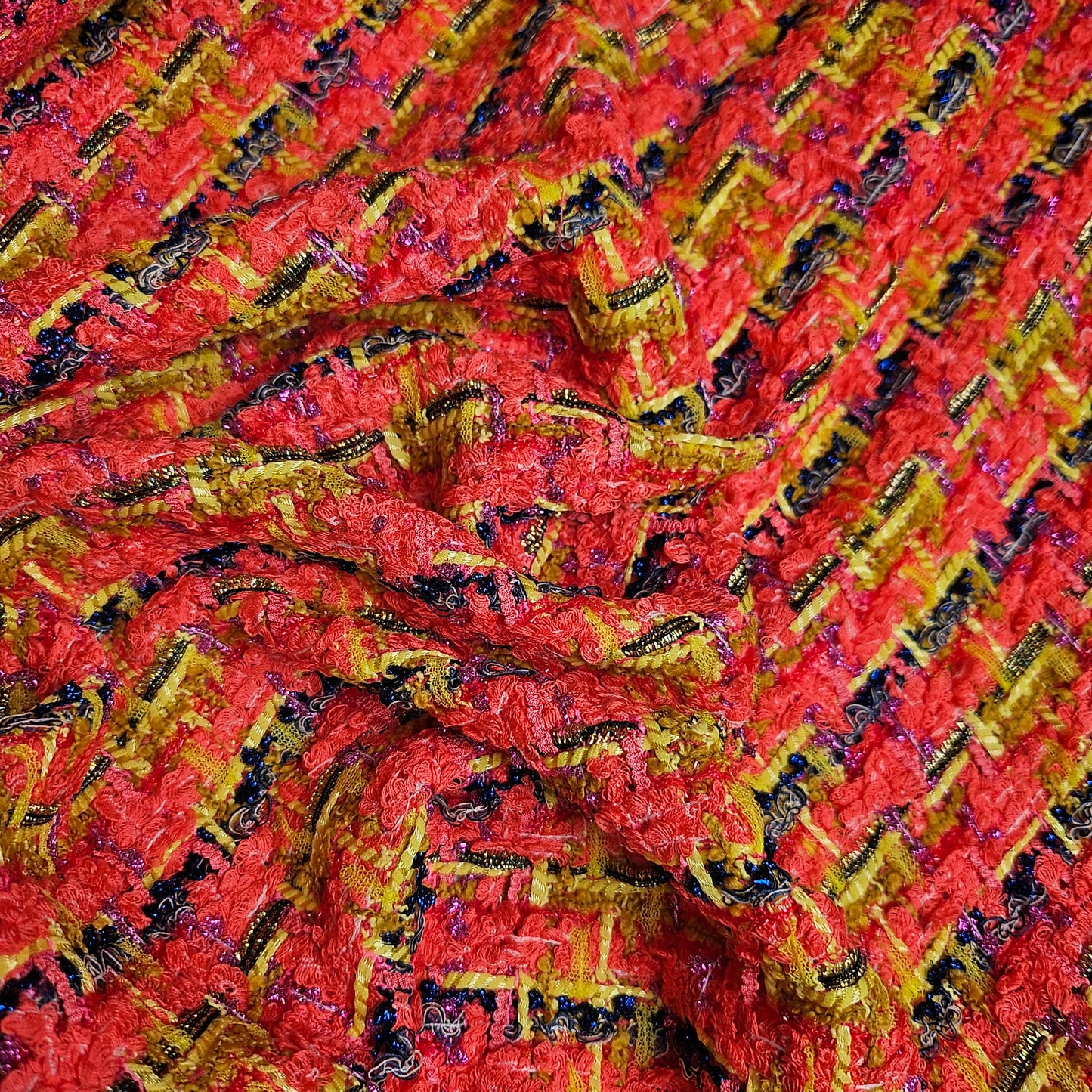 Red, yellow, and black textured tweed fabric with metallic threads, 150cm wide.