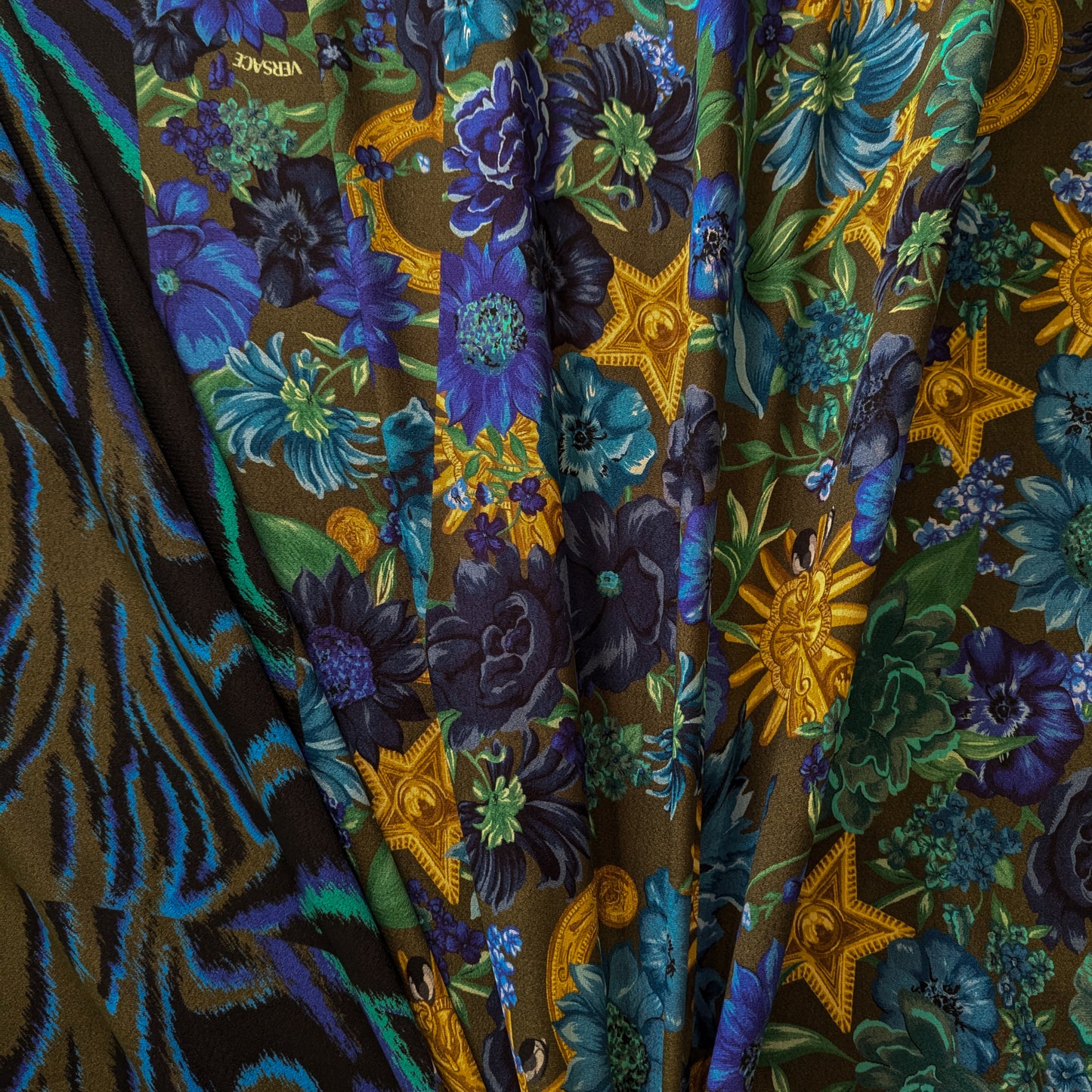 Viskosecrepe panel with dark green background, blue floral, and gold baroque patterns, plus a blue zebra print border.