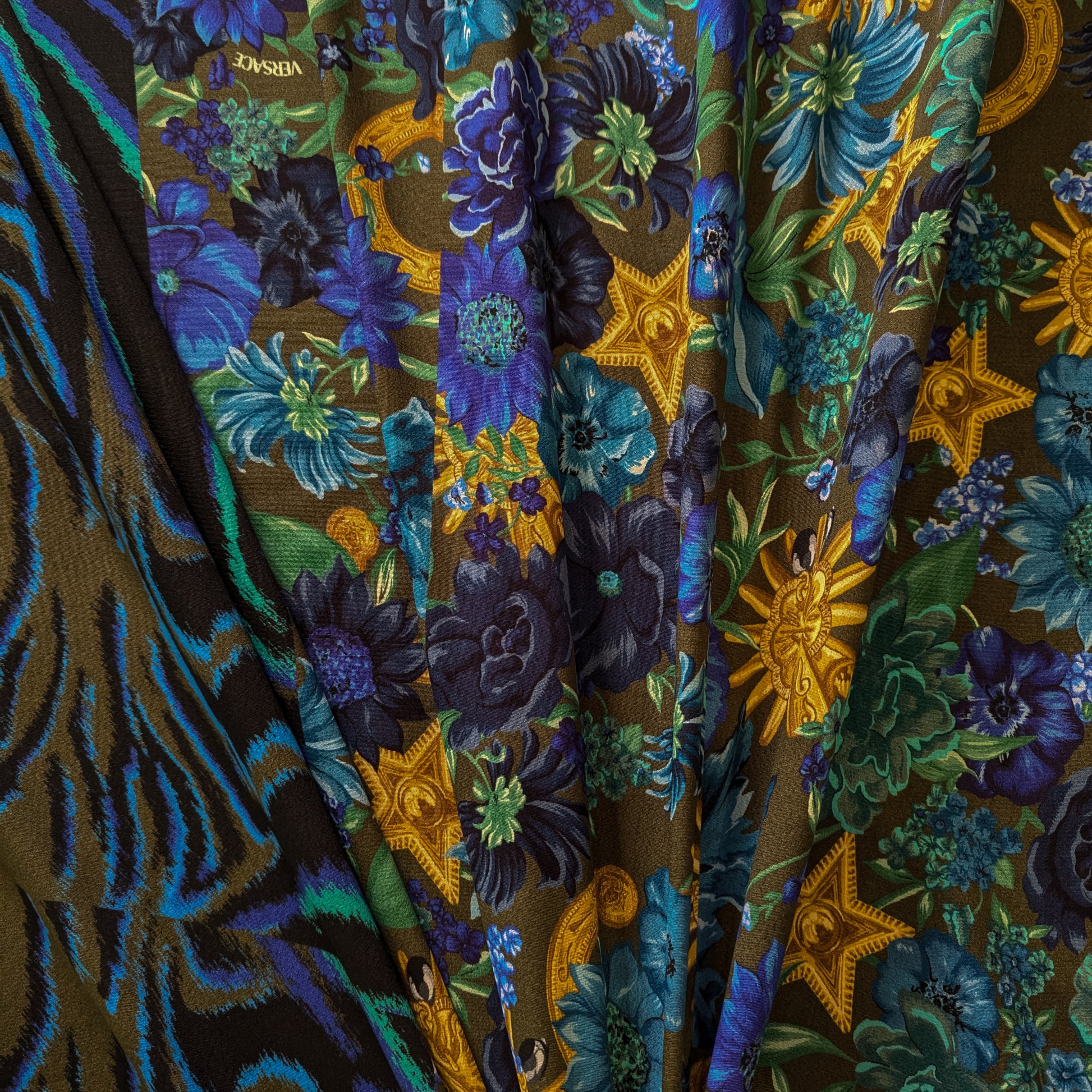 Viskosecrepe panel with dark green background, blue floral, and gold baroque patterns, plus a blue zebra print border.