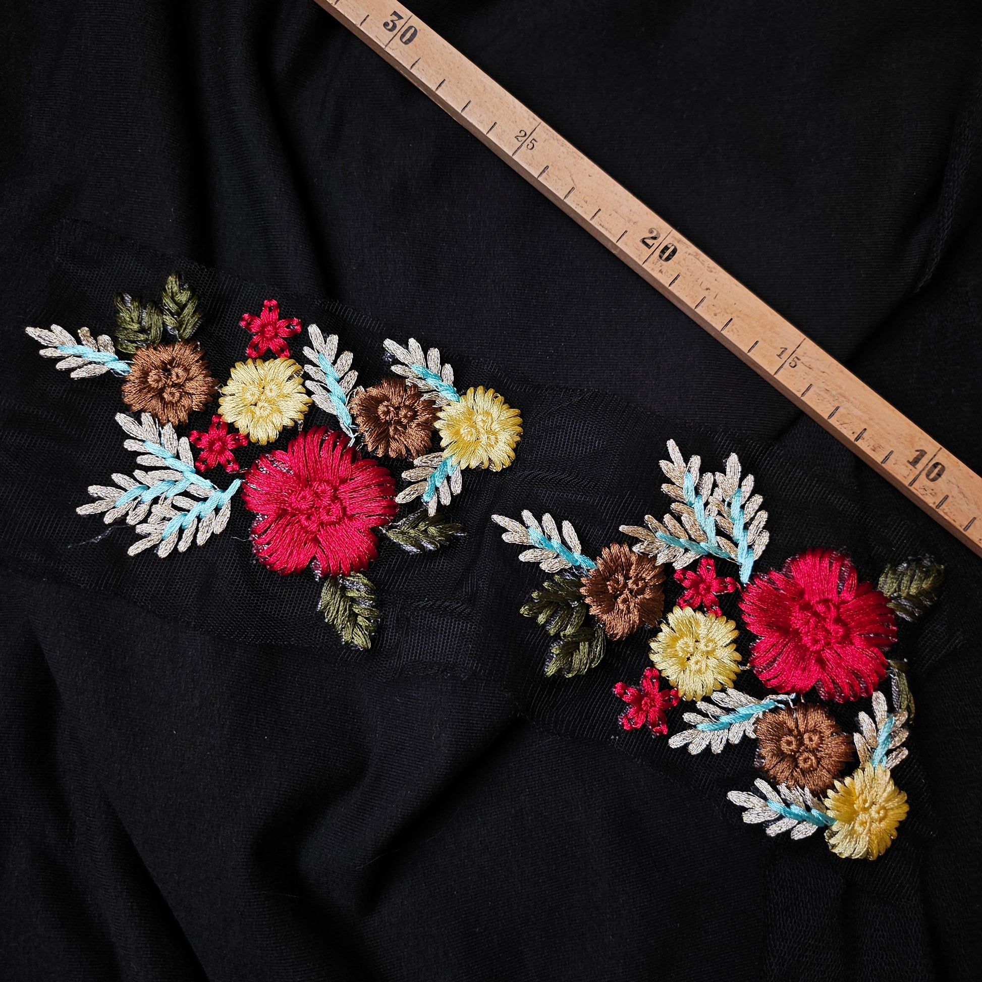 D&G floral embroidered patch, 30 cm, with red, yellow, and brown flowers on black fabric.