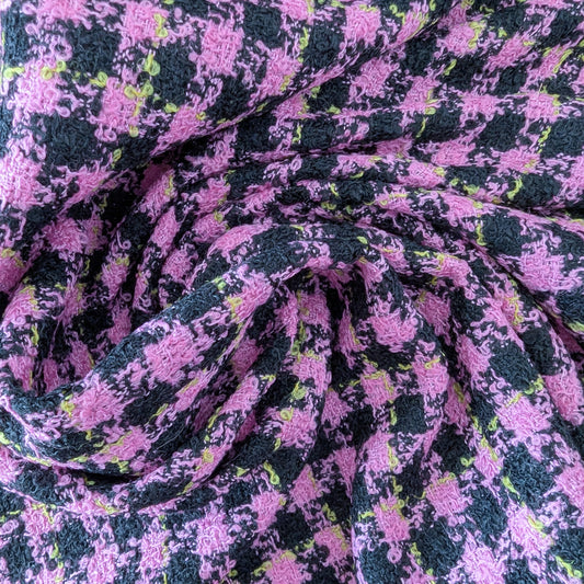 Super pink and black houndstooth tweed wool fabric, 150 cm wide, with subtle purple and lime accents.